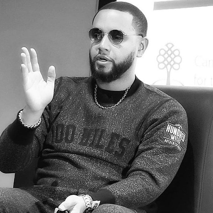 Director X Wearing 100 Miles Sweater and Speaking The History